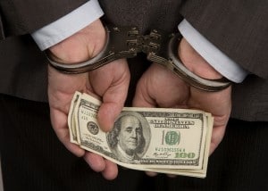 Handcuffs with dollars