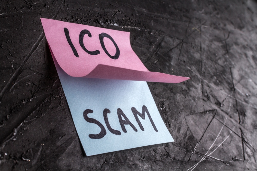 ICO written on a post it note, which is covering a note with SCAM on it