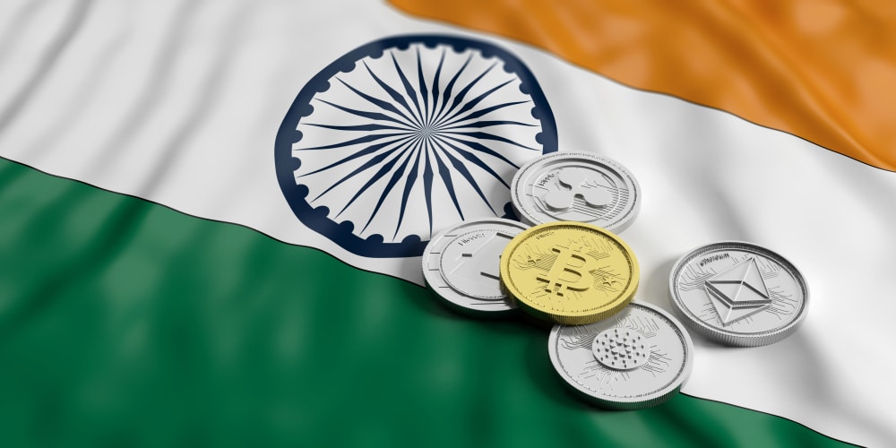 Indian flag with cryptocurreny coins laying on top of it