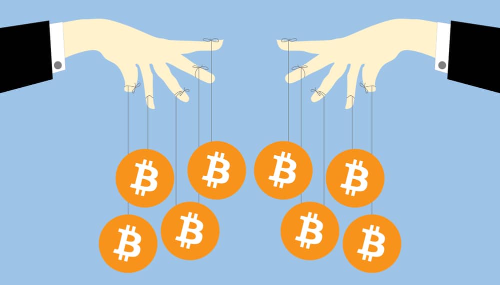 Art of two hands holding bitcoins by string