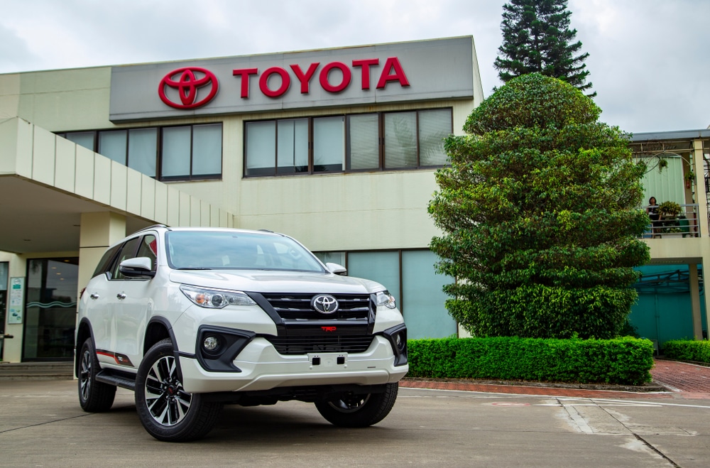 Toyota car in front of a Toyota building