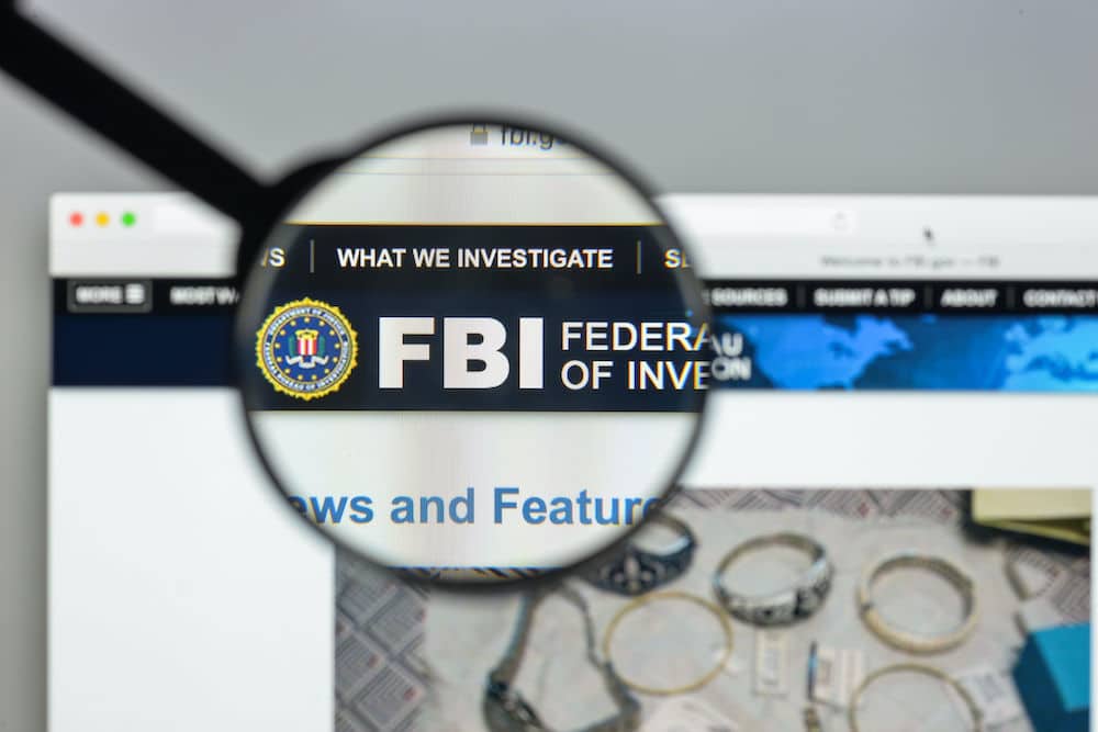 FBI logo through a magnifying glass