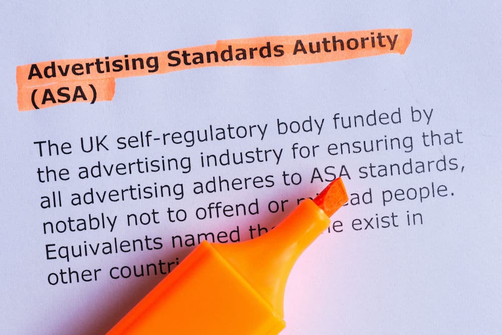 UK ASA definition highlighted using an orange pen