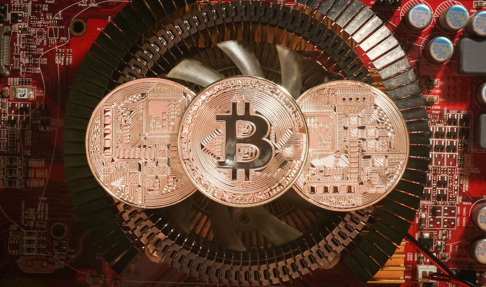 Bitcoin physical coins sitting inside a Computer