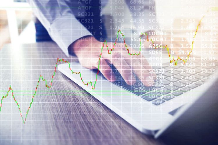 Stock Trading Screen and Price chart edited on top of a man using a laptop