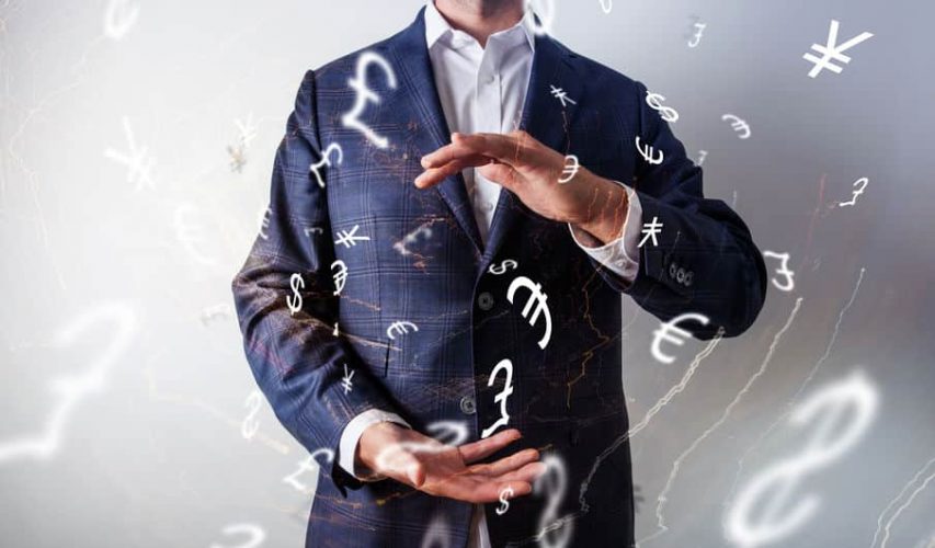 Stock photo of a man with currency symbols