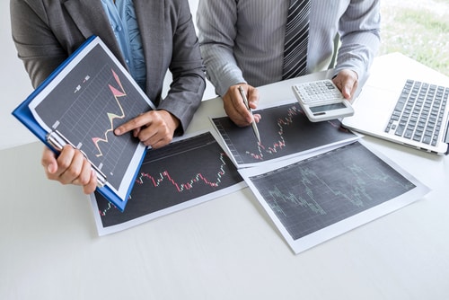 Stock Photo of a Man showing someone else a Stock Market Graph
