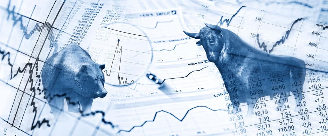 Bull & Bear Statues with Stock Market Charts